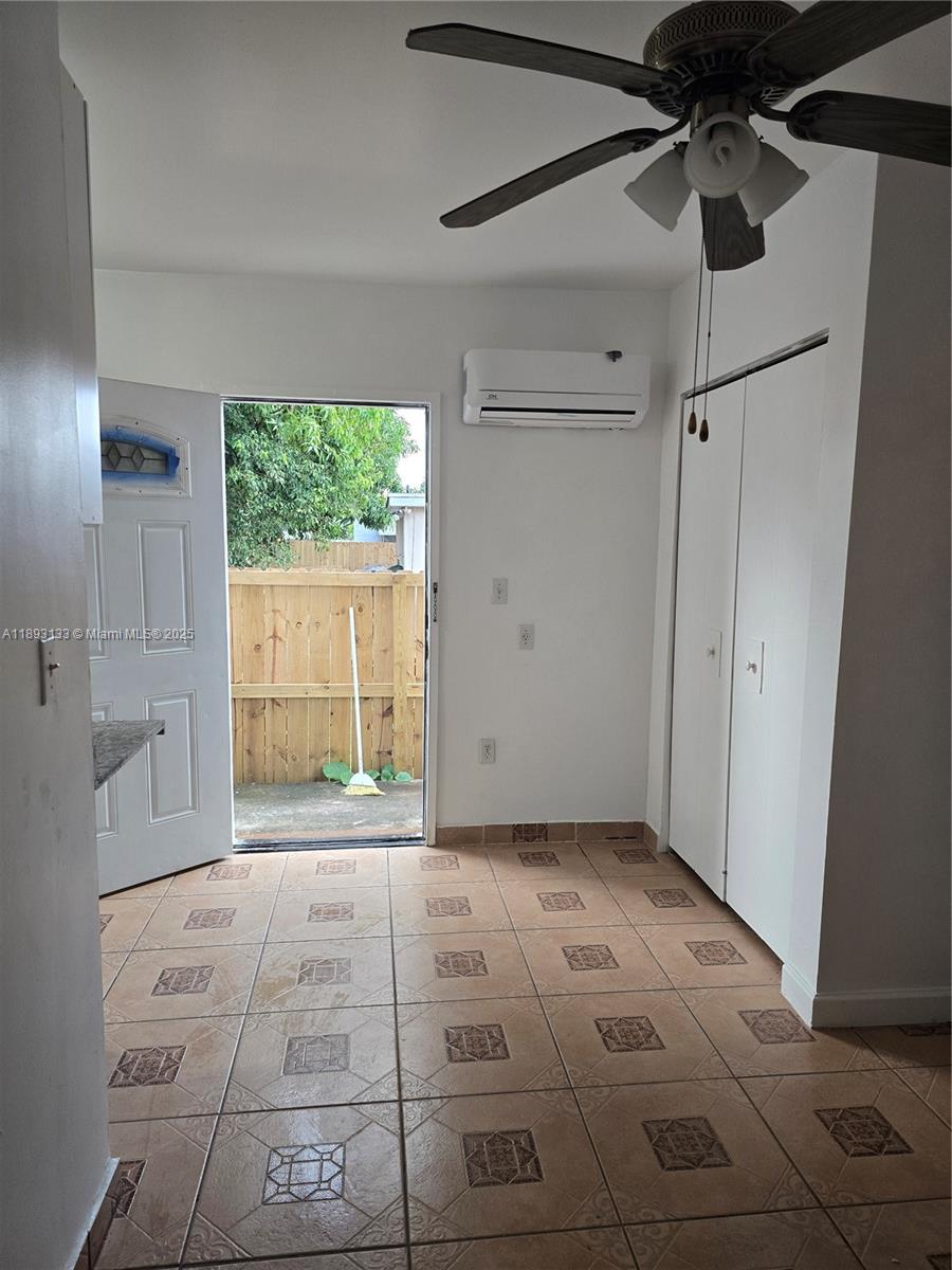 4716 Southwest 1st Street, Unit A Miami, FL 33134 - Photo 2 of 5 a view of an empty room with a window