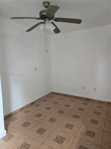 a view of a room with a fan