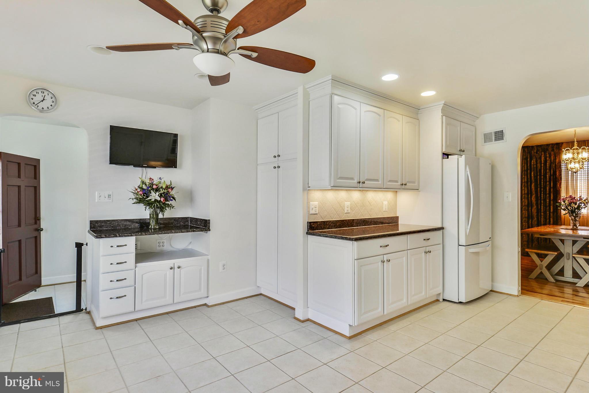 617 Windmill Lane Silver Spring, MD 20905 - Photo 2 of 20 a kitchen with stainless steel appliances granite countertop a stove a refrigerator and a sink