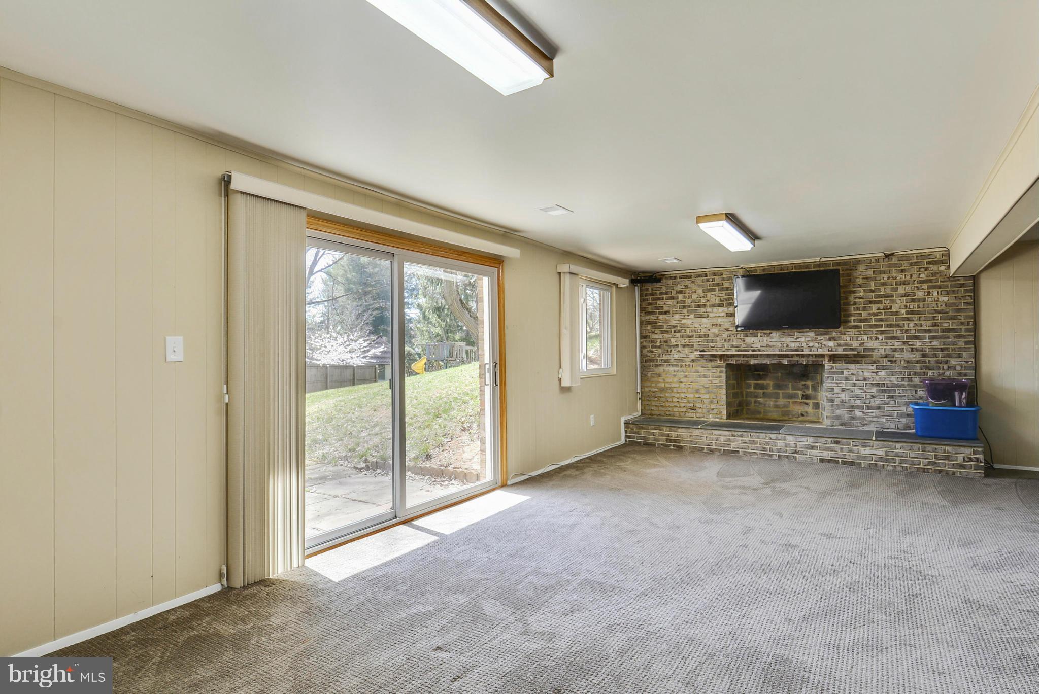 617 Windmill Lane Silver Spring, MD 20905 - Photo 15 of 20 an empty room with furniture and a fireplace