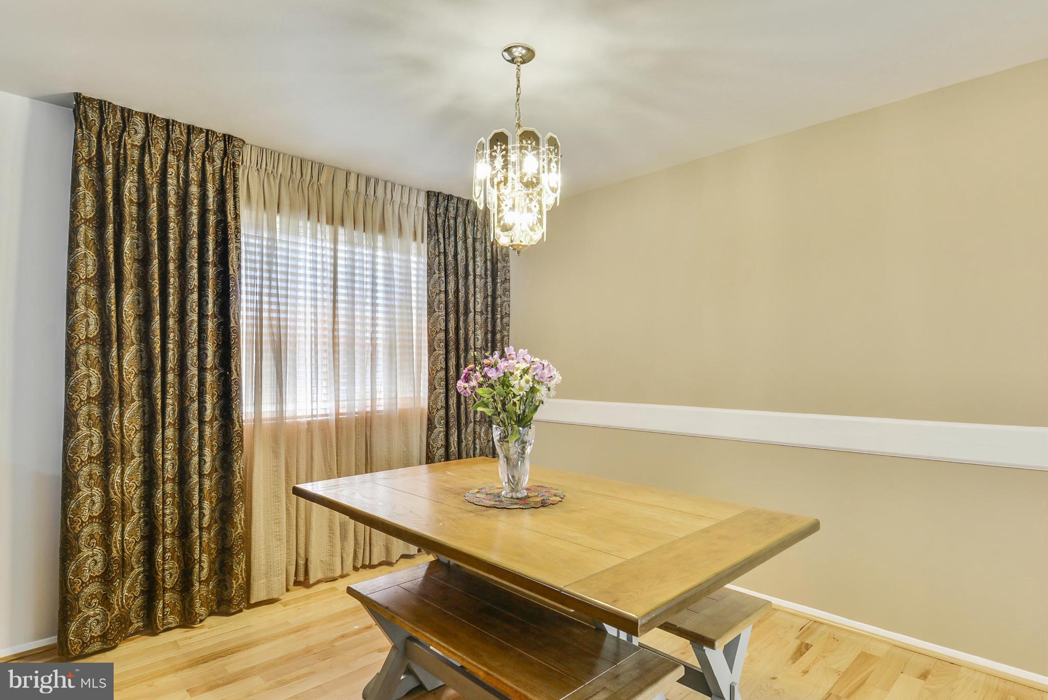 617 Windmill Lane Silver Spring, MD 20905 - Photo 5 of 20 a dining room with chandelier and wooden floor