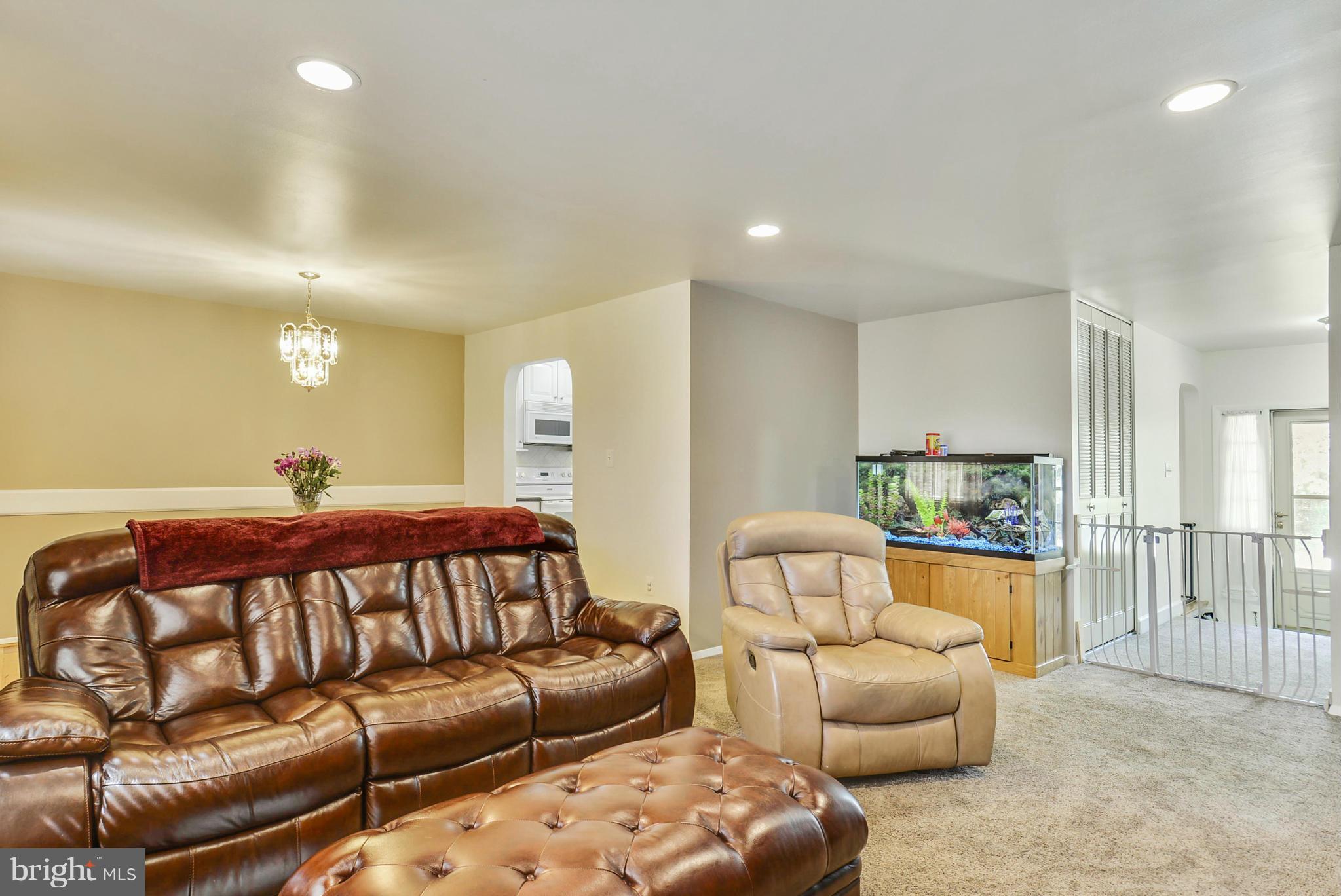 617 Windmill Lane Silver Spring, MD 20905 - Photo 6 of 20 a bed room with a bed and a couch