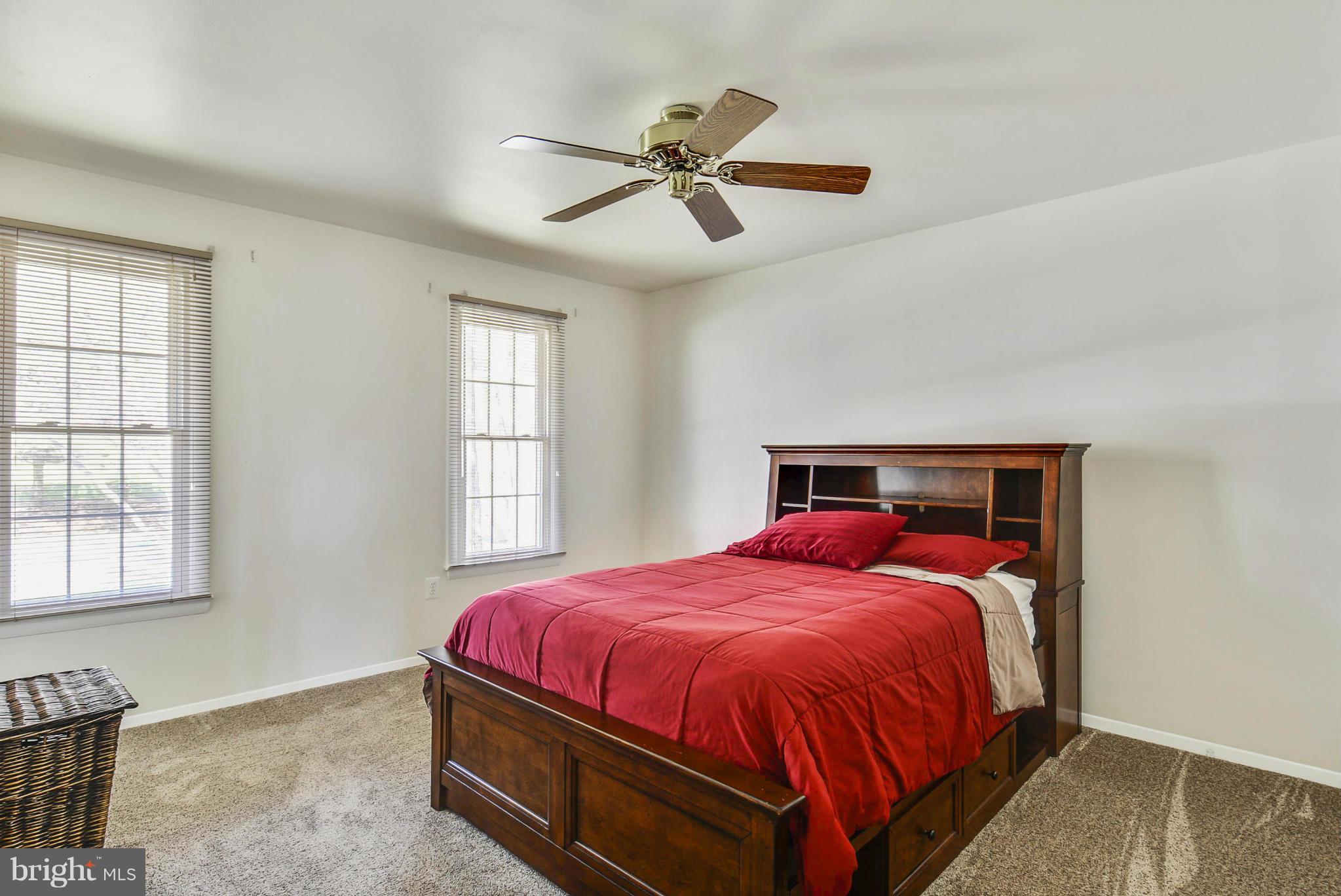617 Windmill Lane Silver Spring, MD 20905 - Photo 8 of 20 a bedroom with a bed and window