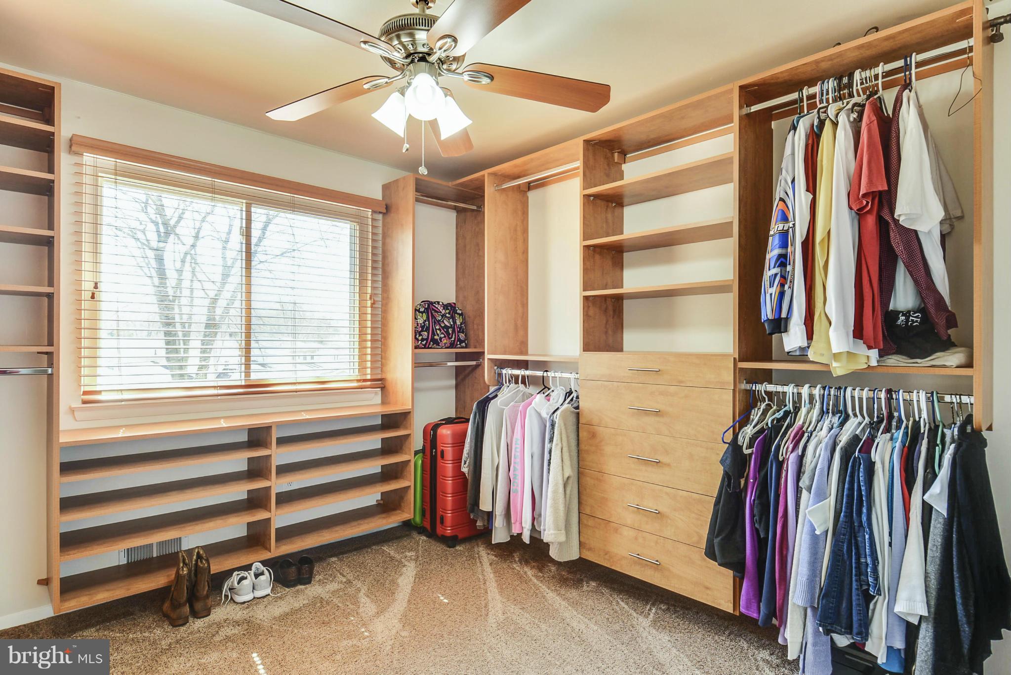 617 Windmill Lane Silver Spring, MD 20905 - Photo 9 of 20 a view of walk in closet with clothes and shoes