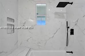 a bathroom with a bathtub