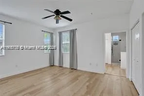 a view of a porch with furniture and garden