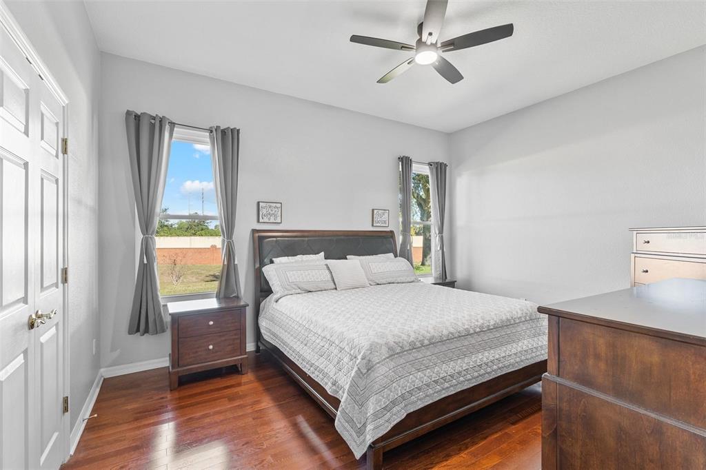 717 Strihal Loop Oakland, FL 34787 - Photo 12 of 32 a bedroom with a bed and window