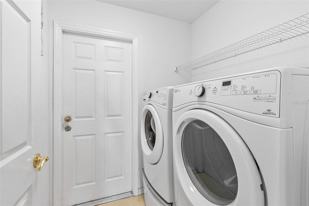 717 Strihal Loop Oakland, FL 34787 - Photo 22 of 32 a utility room with dryer and washer
