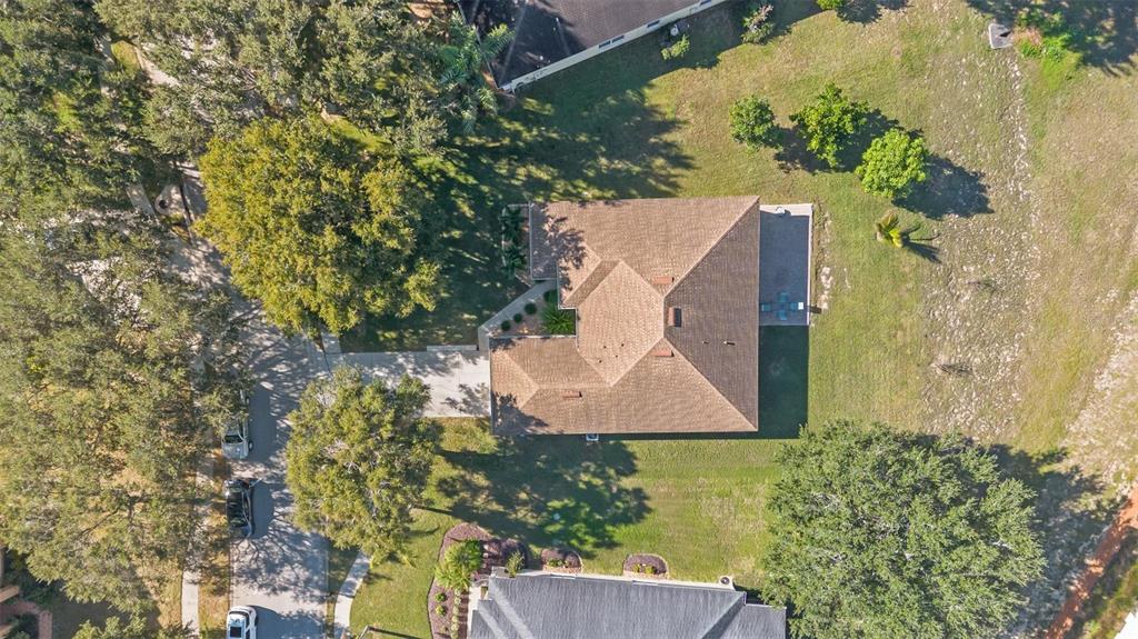 717 Strihal Loop Oakland, FL 34787 - Photo 26 of 32 an aerial view of a house with yard swimming pool and outdoor seating