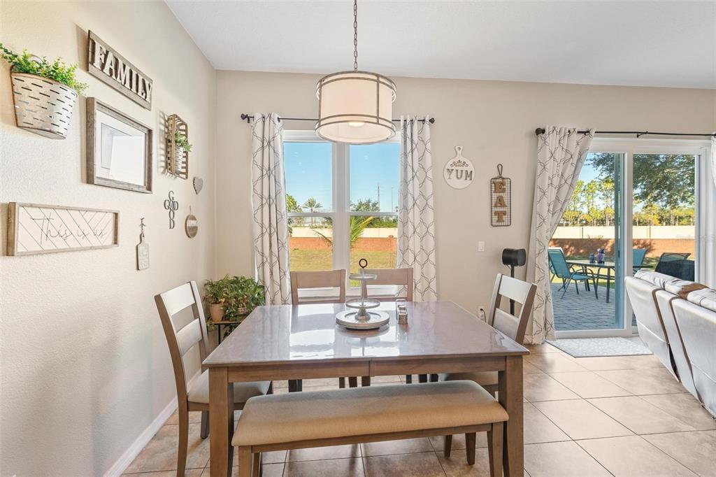 717 Strihal Loop Oakland, FL 34787 - Photo 6 of 32 a view of a dining room with furniture window and outside view