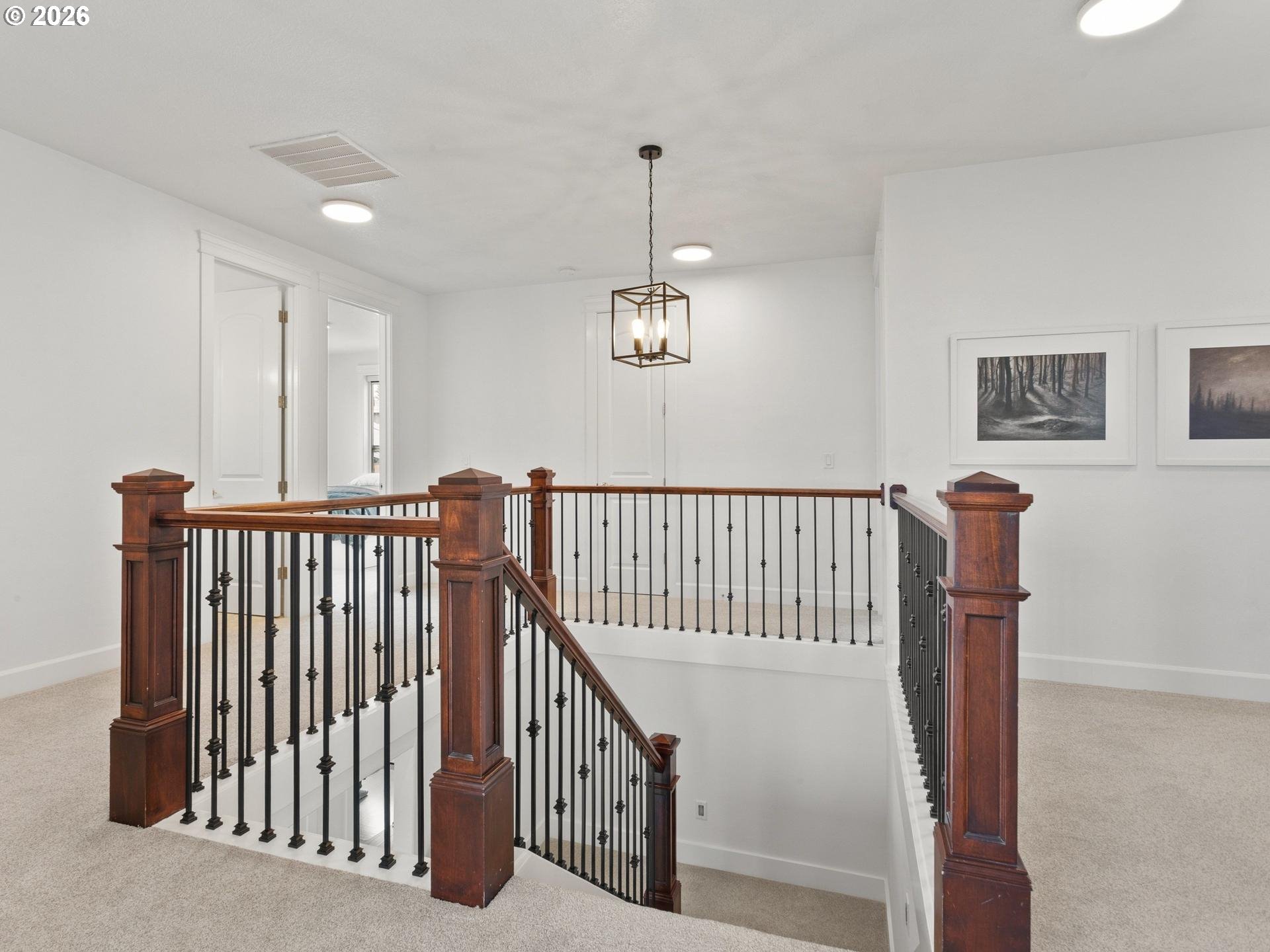 1012 Northwest Goodwin Street Camas, WA 98607 - Photo 25 of 44 a view of staircase with railing and a chandelier