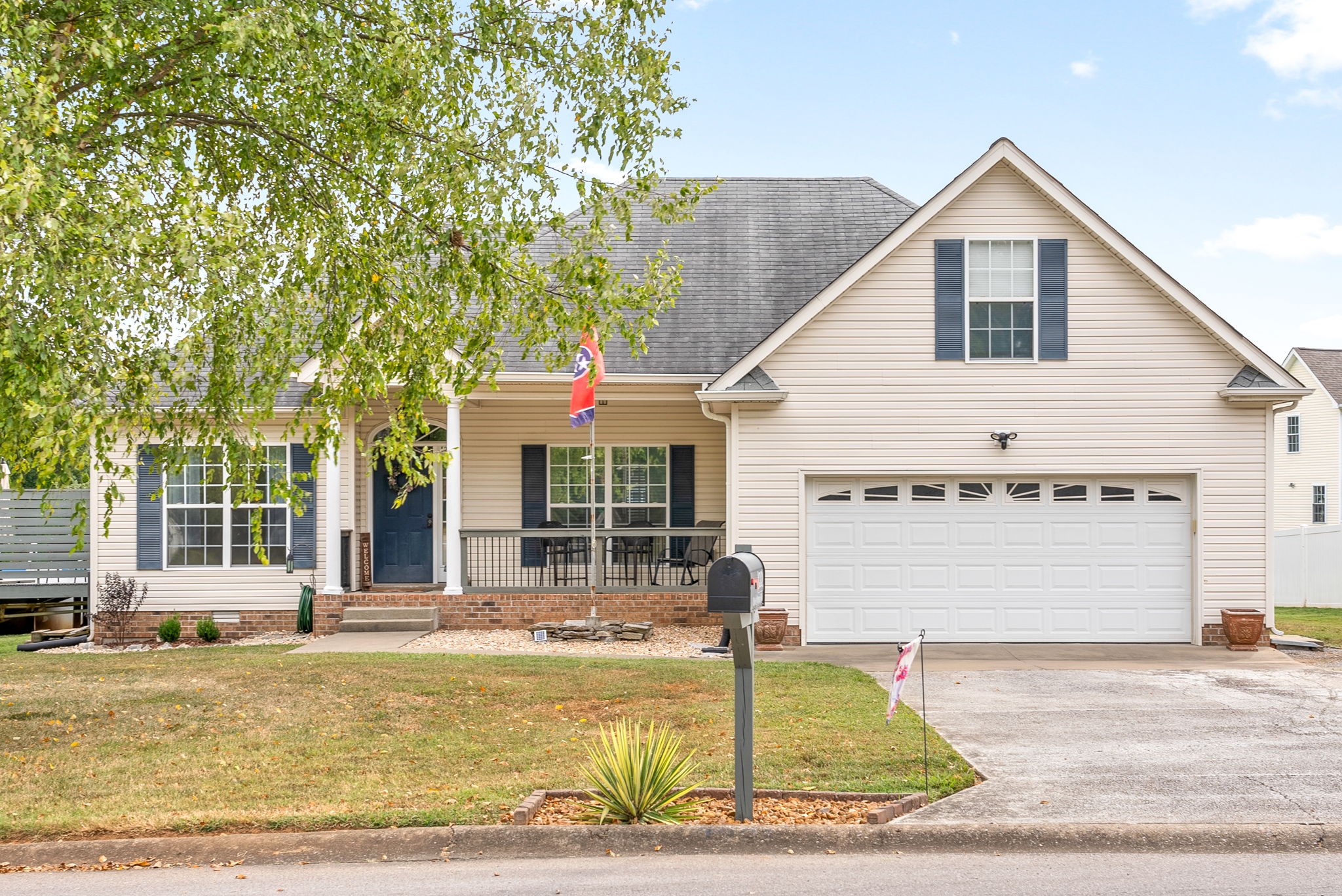a view of a white house with a swimming pool