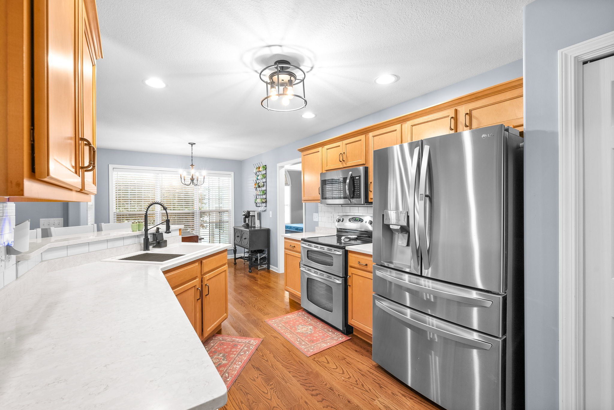 1221 Olive Branch Road Clarksville, TN 37042 - Photo 12 of 36 a kitchen with stainless steel appliances granite countertop a refrigerator and a sink