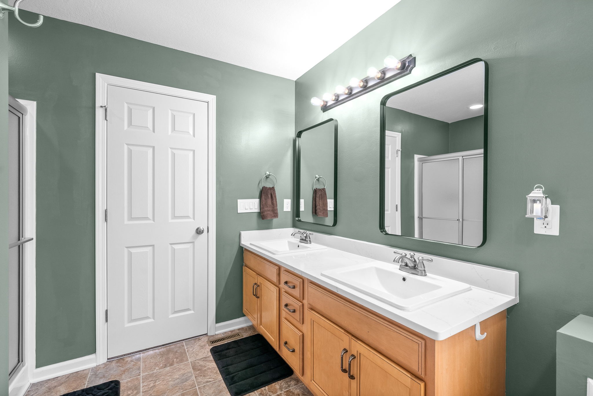 1221 Olive Branch Road Clarksville, TN 37042 - Photo 20 of 36 a bathroom with a double vanity sink and a mirror