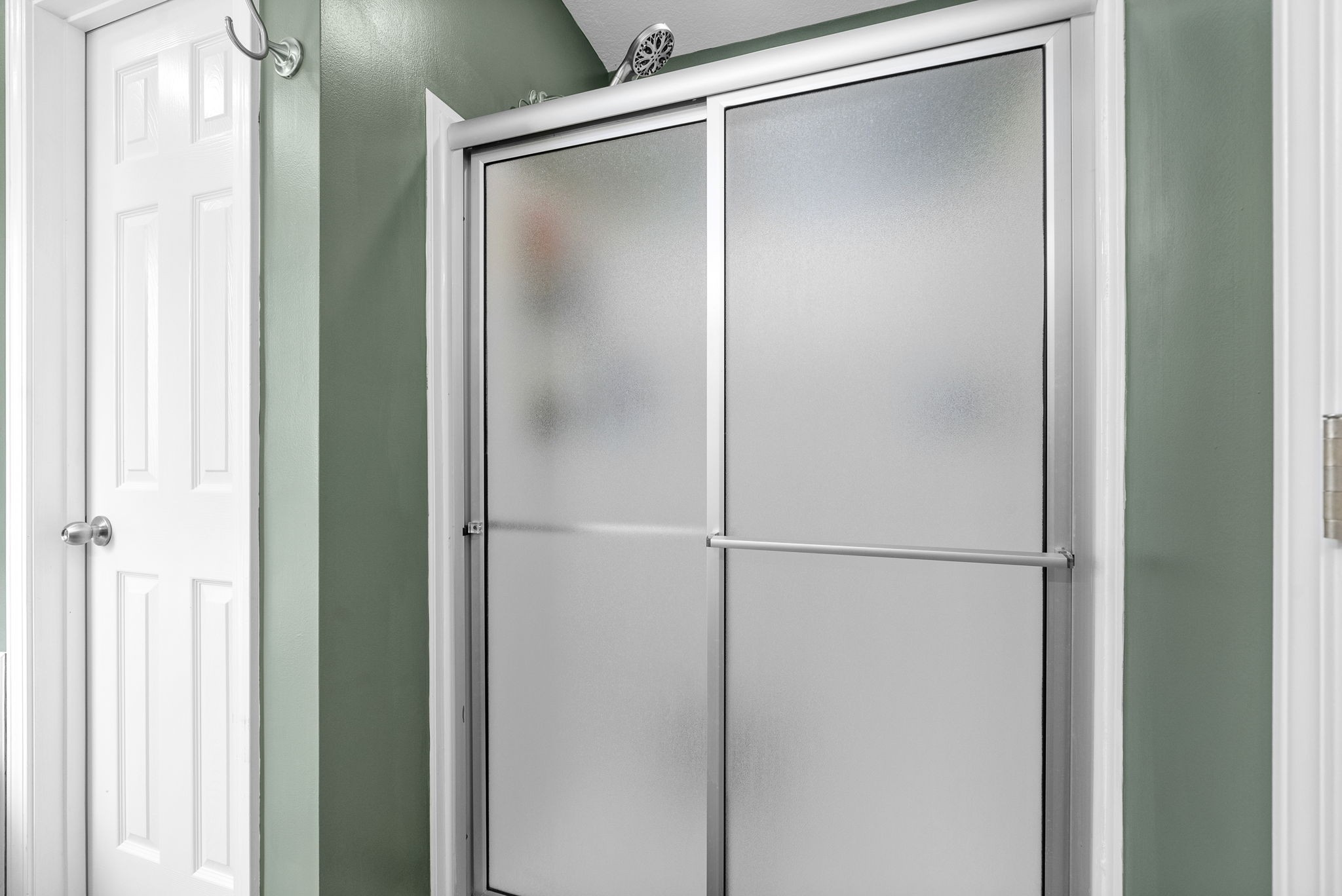 1221 Olive Branch Road Clarksville, TN 37042 - Photo 21 of 36 a bathroom with a glass shower door