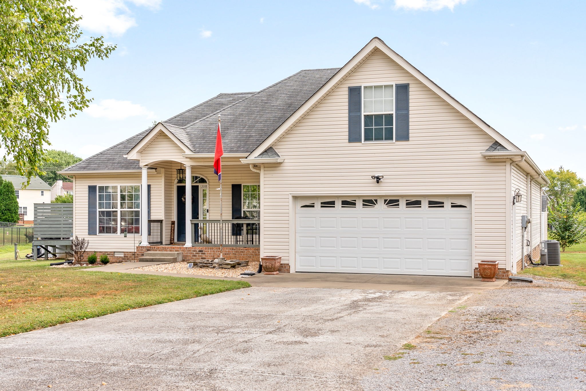 1221 Olive Branch Road Clarksville, TN 37042 - Photo 3 of 36 a view of a white house with a yard and large tree