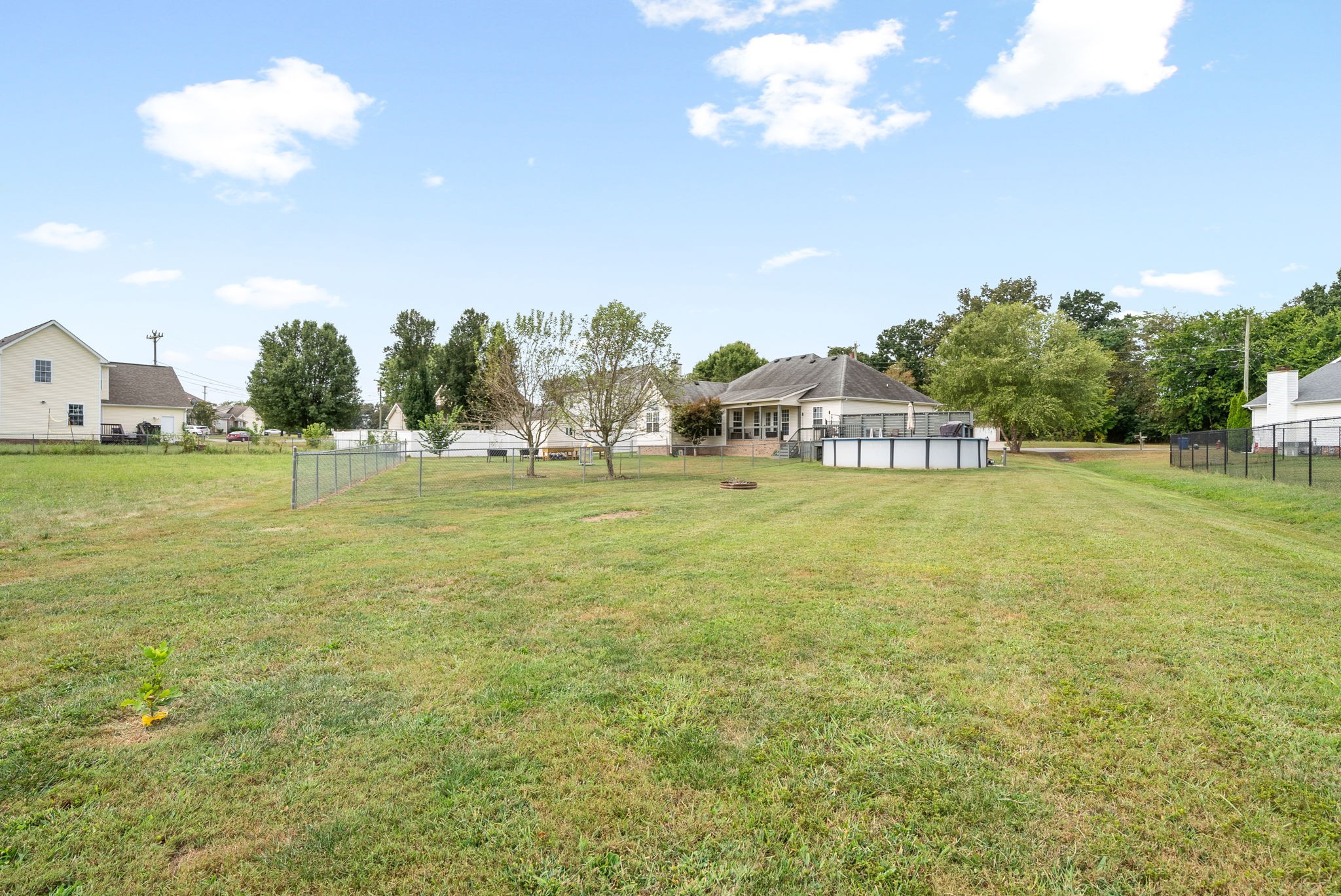 1221 Olive Branch Road Clarksville, TN 37042 - Photo 35 of 36 a swimming pool that has lawn chairs with large trees