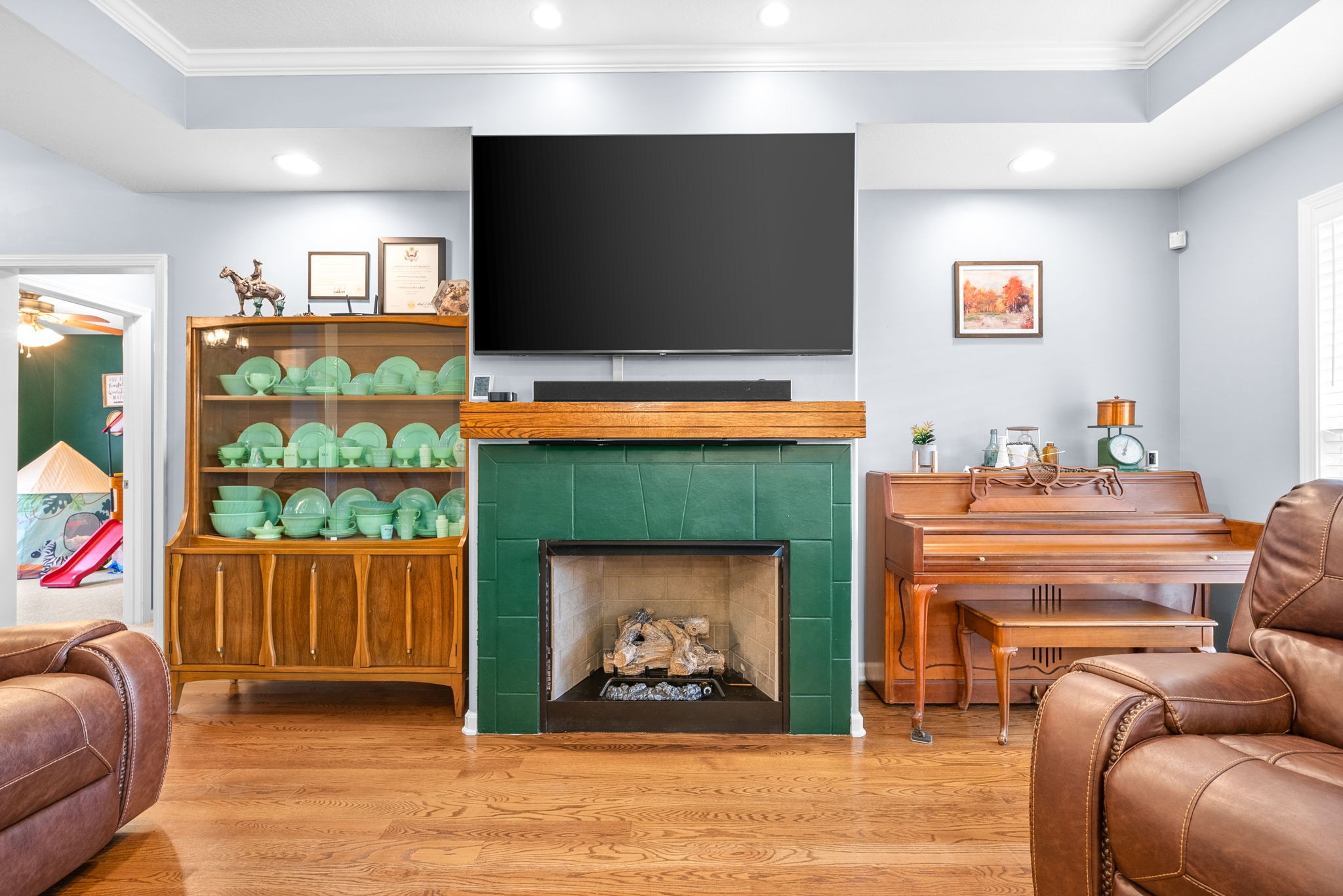 1221 Olive Branch Road Clarksville, TN 37042 - Photo 9 of 36 a living room with furniture a flat screen tv and a fireplace