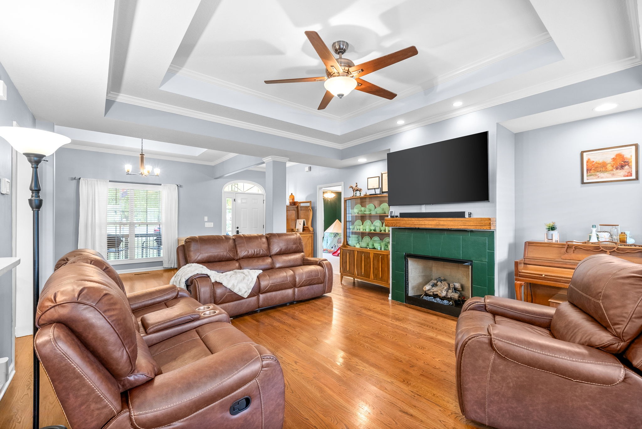 1221 Olive Branch Road Clarksville, TN 37042 - Photo 10 of 36 a living room with furniture a fireplace and a flat screen tv