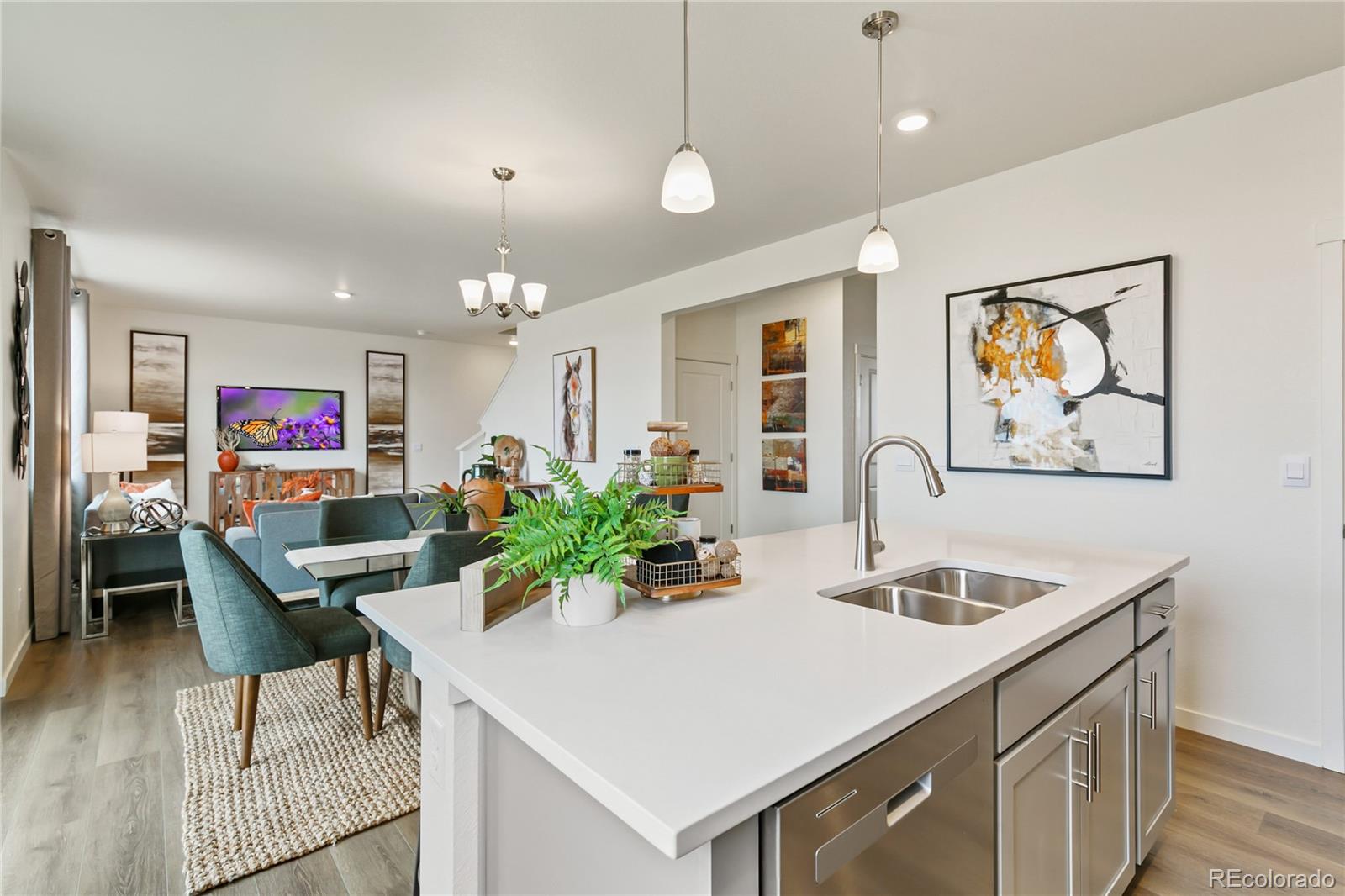9935 Ceylon Court Commerce City, CO 80022 - Photo 11 of 44 a view of a dining room with furniture