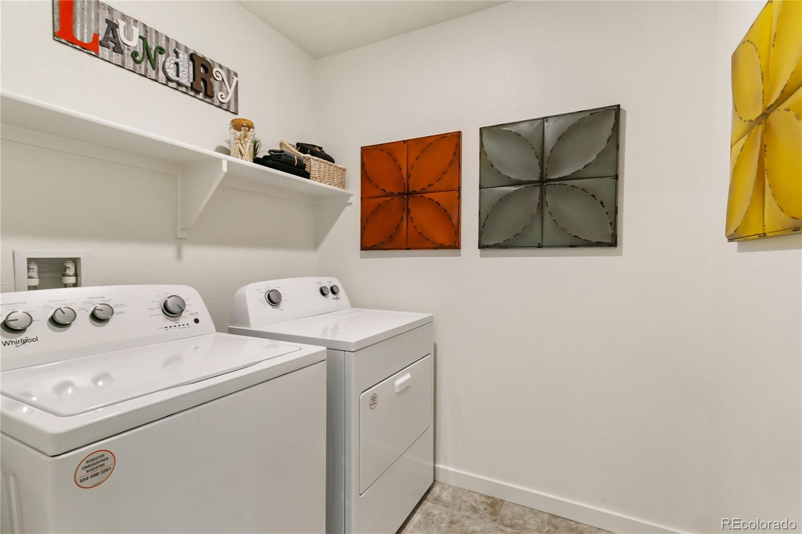 9935 Ceylon Court Commerce City, CO 80022 - Photo 29 of 44 a utility room with dryer and washer