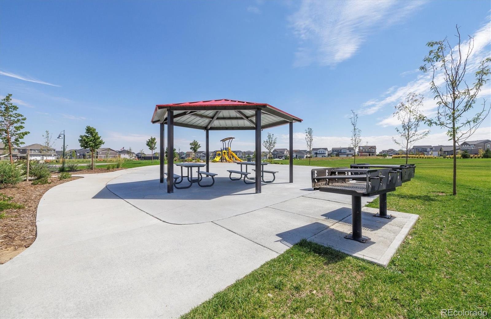 9935 Ceylon Court Commerce City, CO 80022 - Photo 40 of 44 a view of a park with sitting area