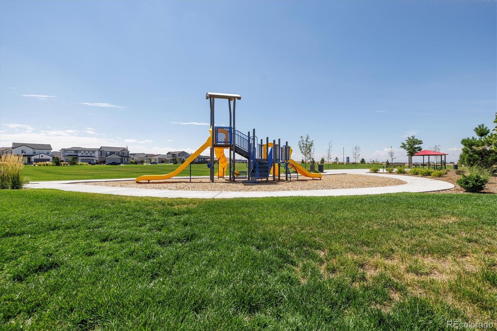 9935 Ceylon Court Commerce City, CO 80022 - Photo 44 of 44 a view of a park with swings and slides
