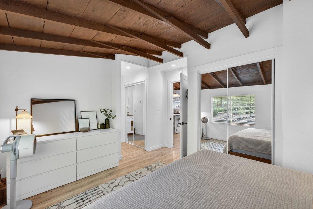 125 Shadowbrook Road Ben Lomond, CA 95005 - Photo 27 of 60 a bedroom with a balcony a bed and a mirror