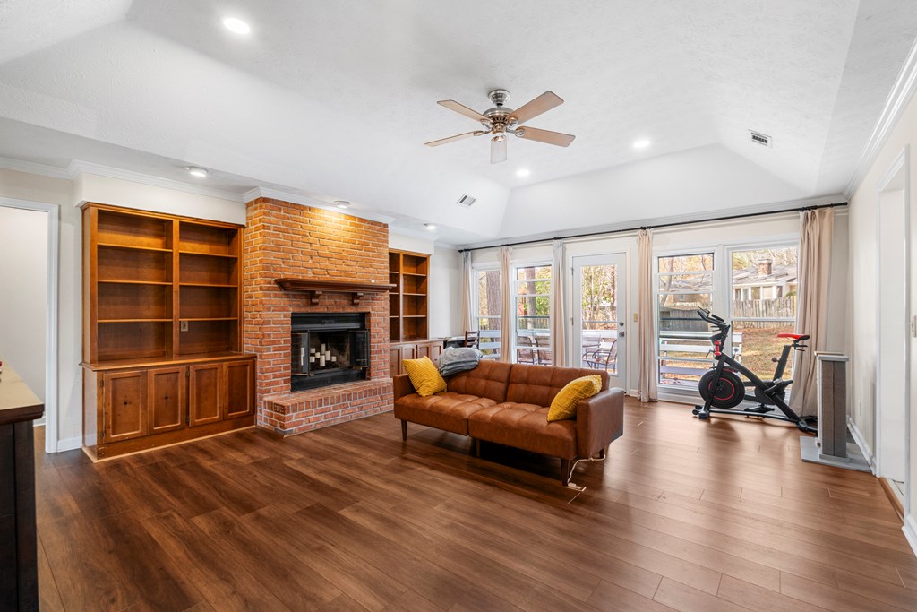 3 Panstone Court Columbus, GA 31909 - Photo 5 of 24 a living room with furniture a fireplace and a flat screen tv