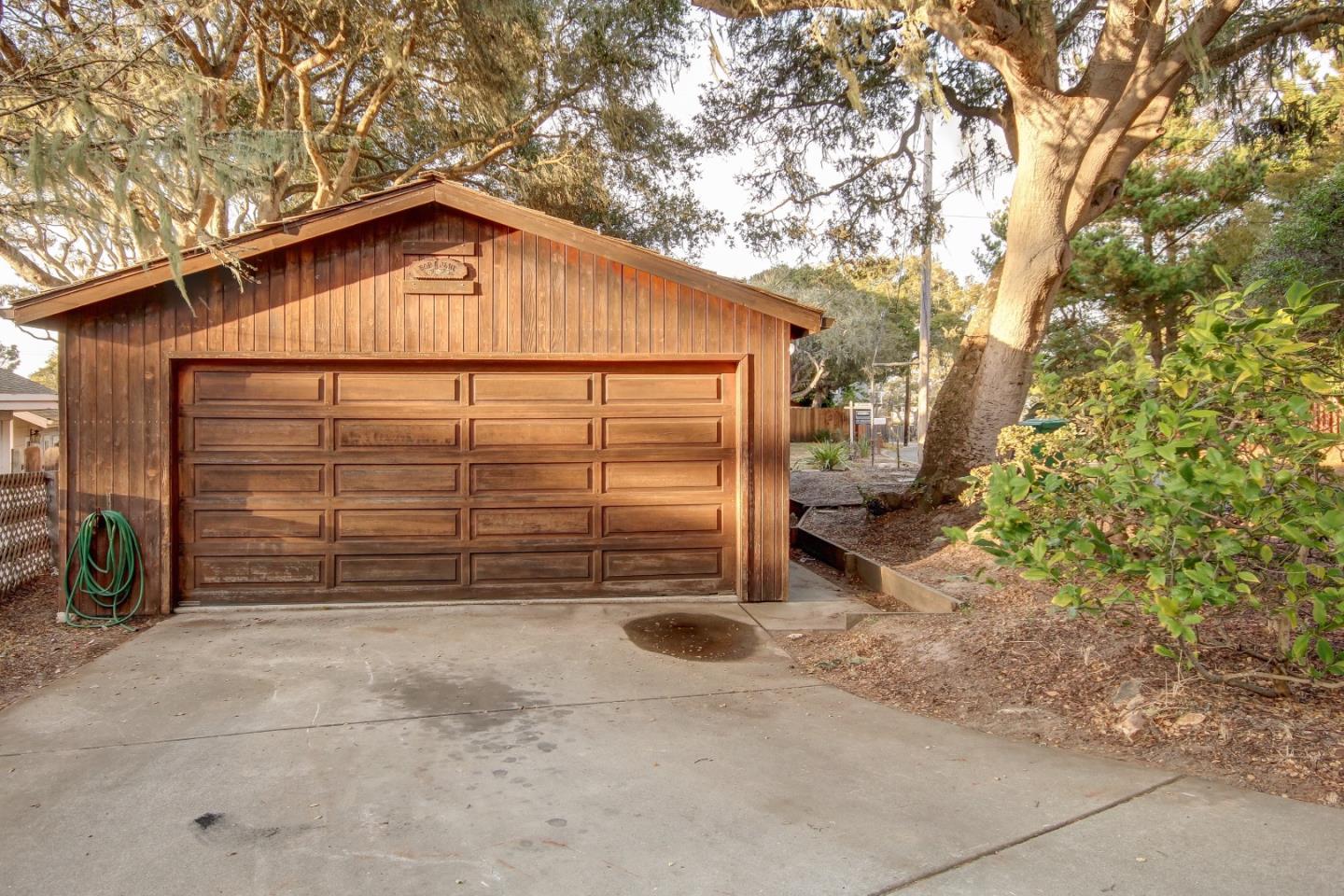 816 Gate Street Pacific Grove, CA 93950 - Photo 17 of 18 a view of backyard of house with an outdoor seating