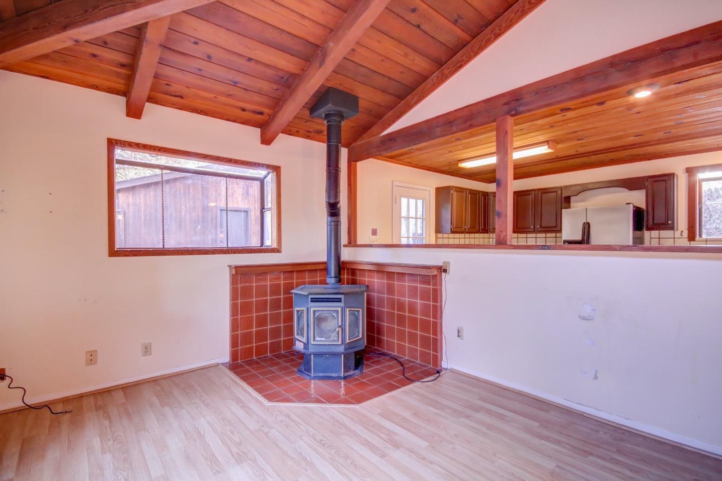 816 Gate Street Pacific Grove, CA 93950 - Photo 4 of 18 a view of empty room with wooden floor and fan