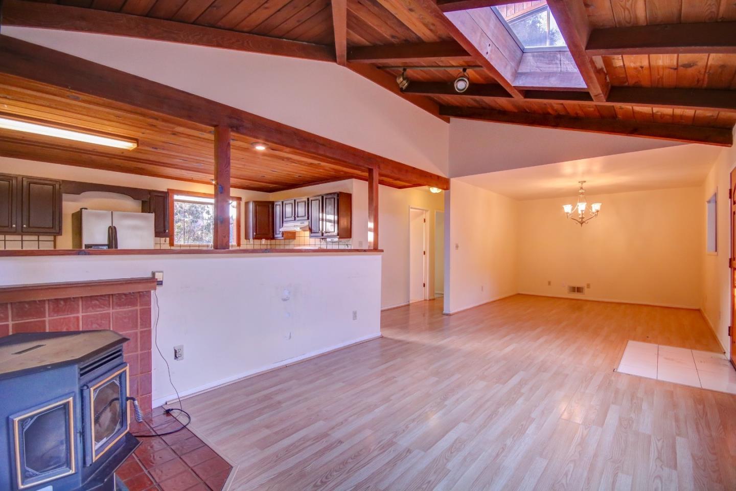 816 Gate Street Pacific Grove, CA 93950 - Photo 5 of 18 a view of a livingroom with wooden floor and staircase