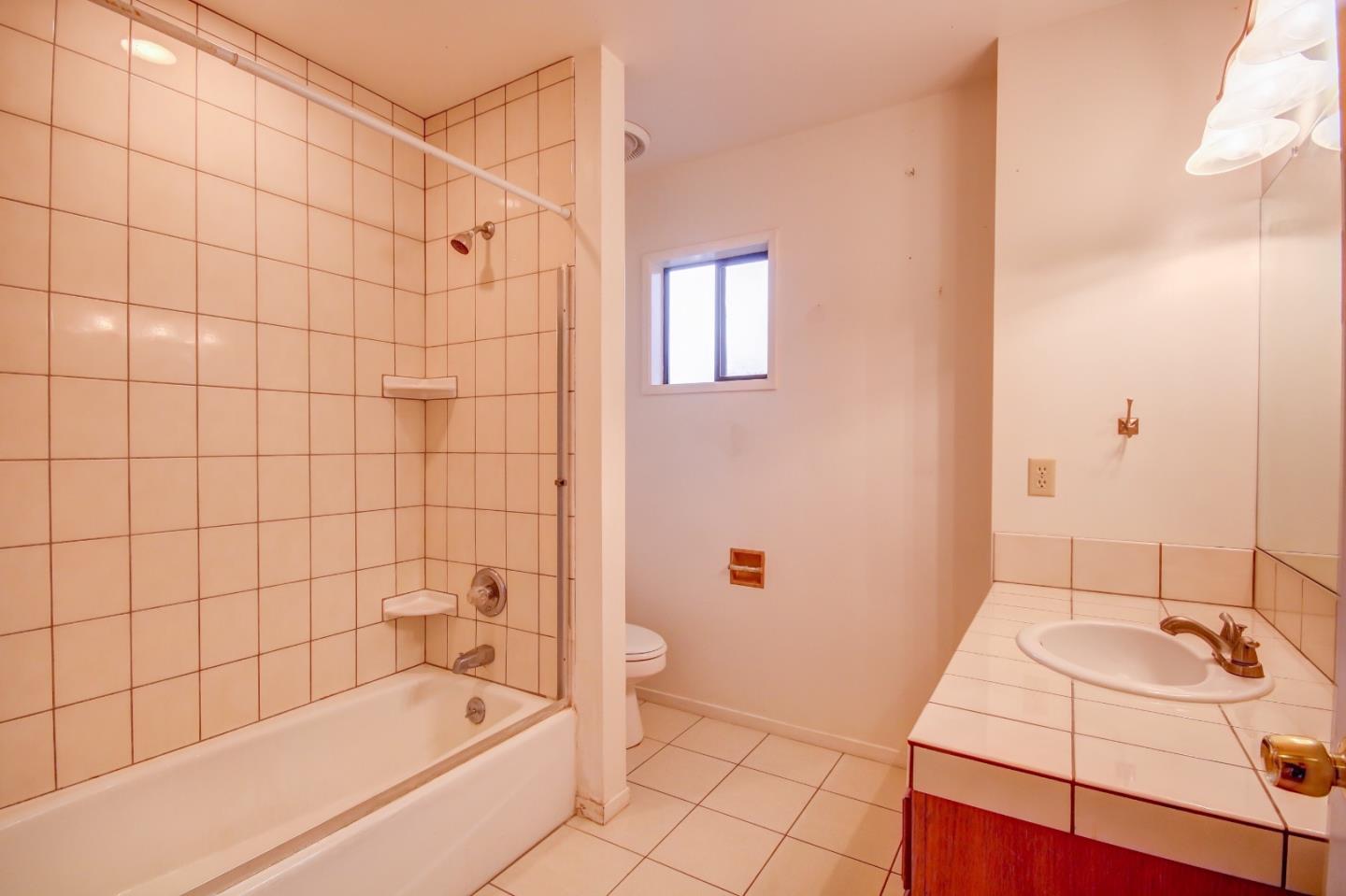 816 Gate Street Pacific Grove, CA 93950 - Photo 9 of 18 a bathroom with a sink and a bathtub