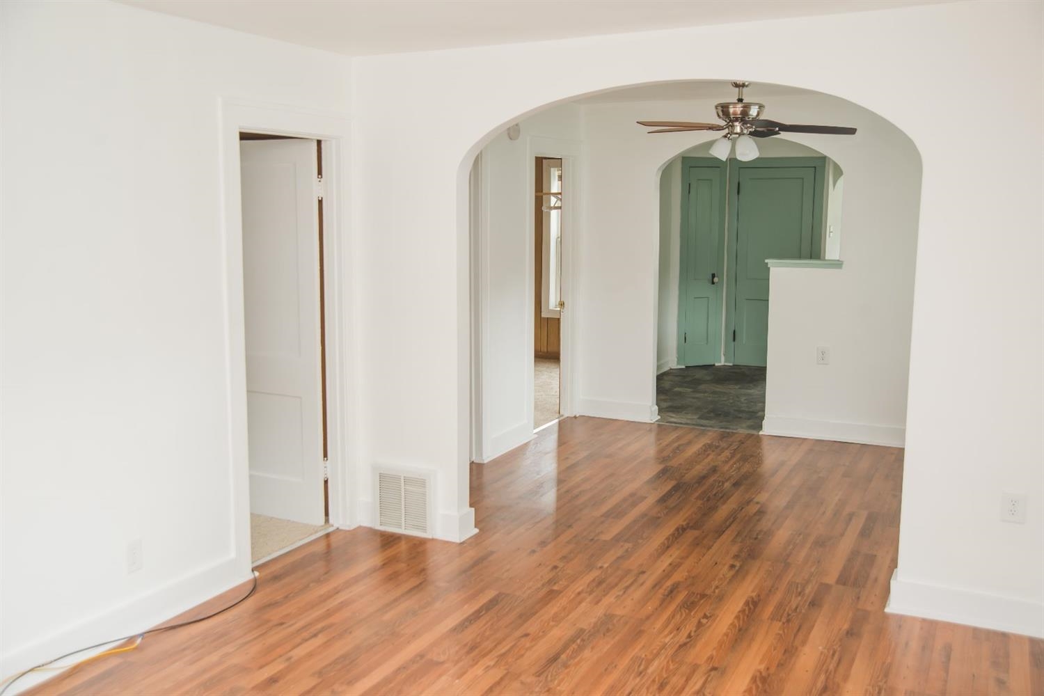 3018 West Old Ridge Road Hobart, IN 46342 - Photo 4 of 10 an empty room with wooden floor and entryway