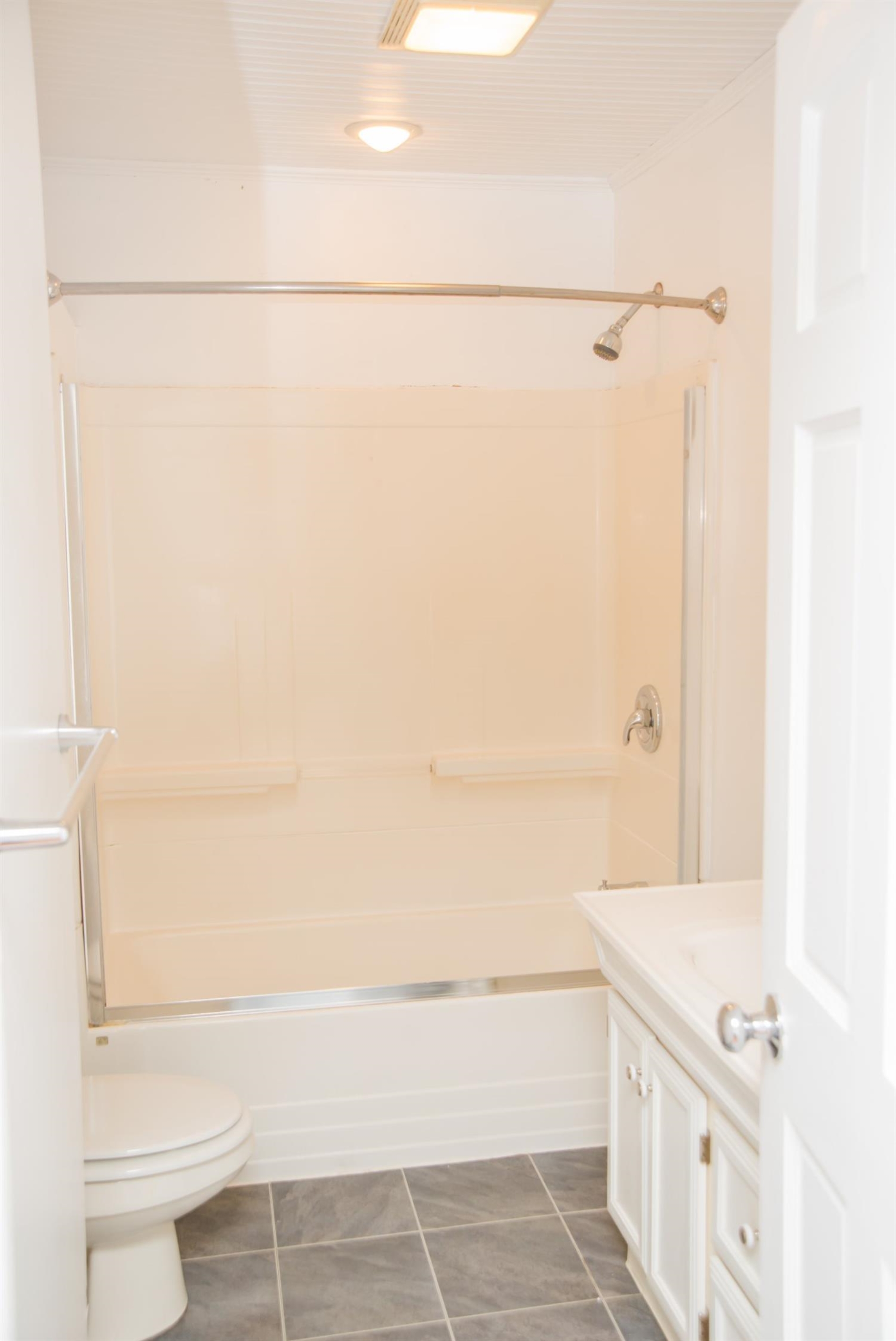 3018 West Old Ridge Road Hobart, IN 46342 - Photo 6 of 10 a bathroom with a bathtub and a shower