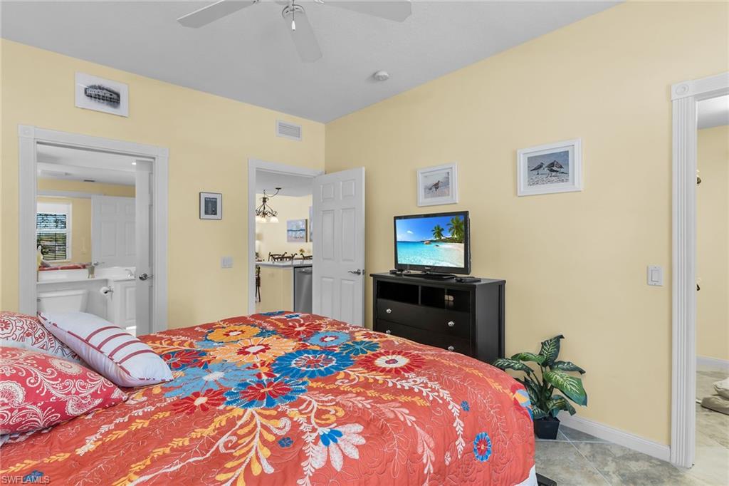 8044 Josefa Way Naples, FL 34114 - Photo 13 of 41 Bedroom with baseboards and light tile patterned floors