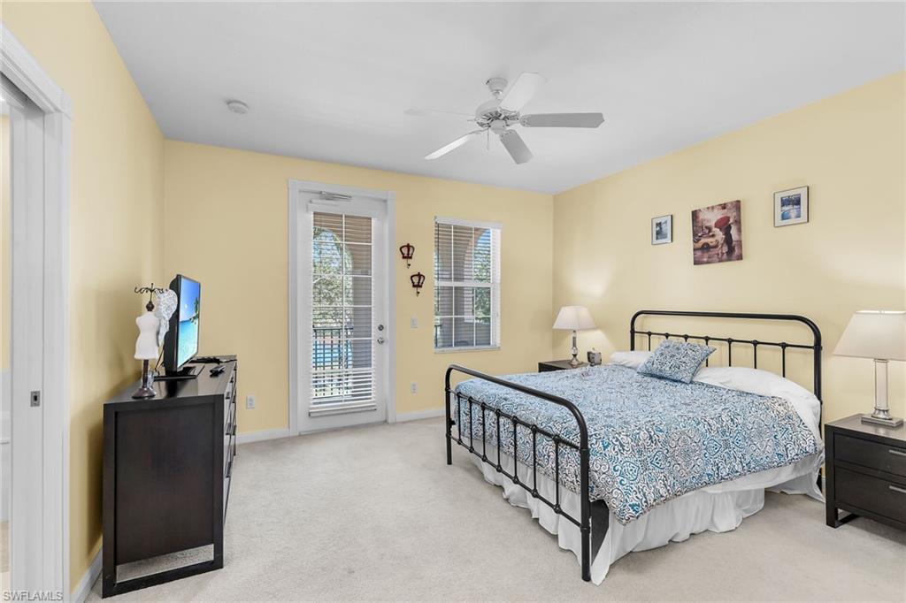 8044 Josefa Way Naples, FL 34114 - Photo 20 of 41 Bedroom with access to outside, light colored carpet, and ceiling fan