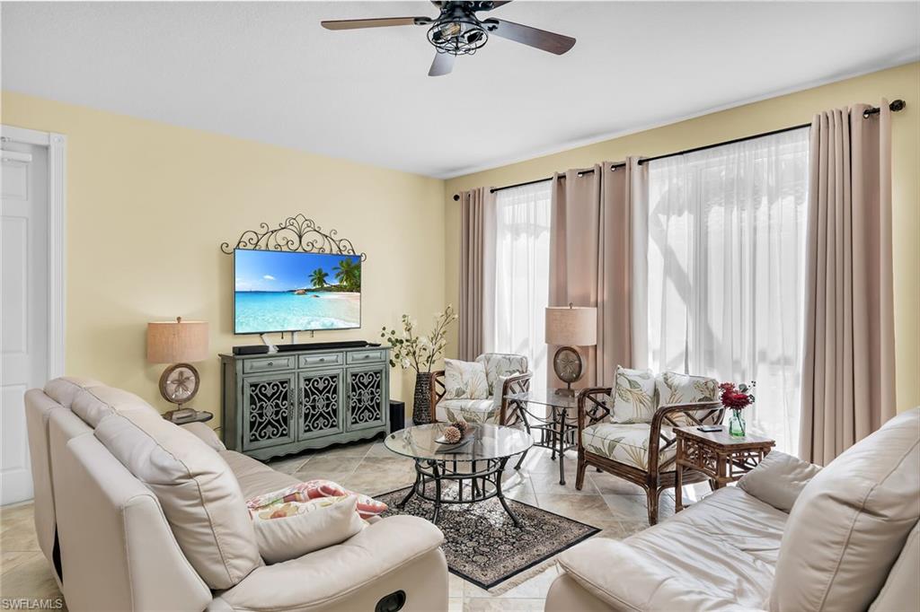 8044 Josefa Way Naples, FL 34114 - Photo 3 of 41 Living room featuring a ceiling fan