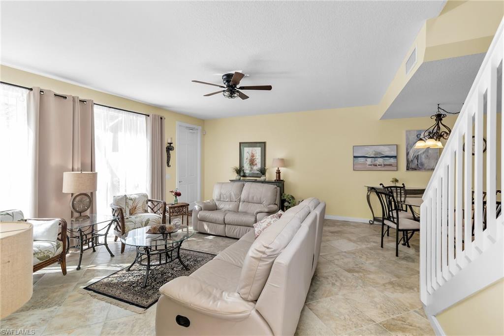 8044 Josefa Way Naples, FL 34114 - Photo 6 of 41 Living room with stairs and a ceiling fan
