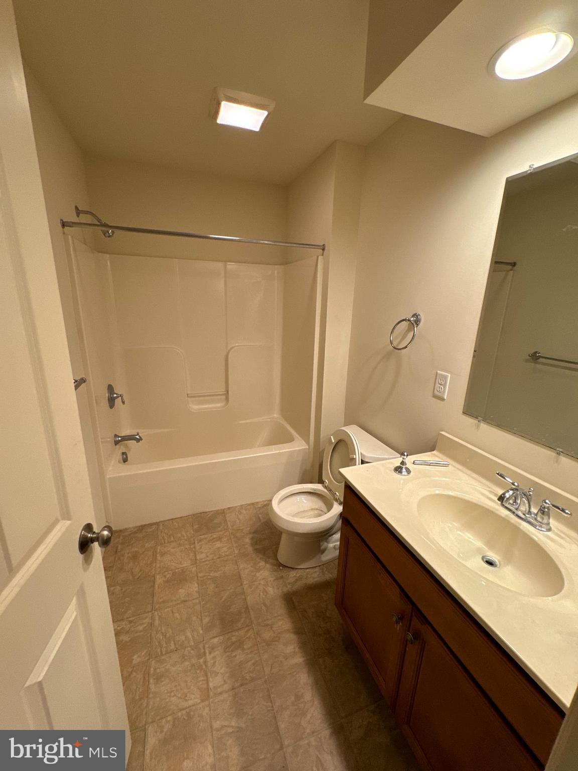 100 Scully Place Lewisberry, PA 17339 - Photo 11 of 12 a bathroom with a granite countertop sink toilet and shower