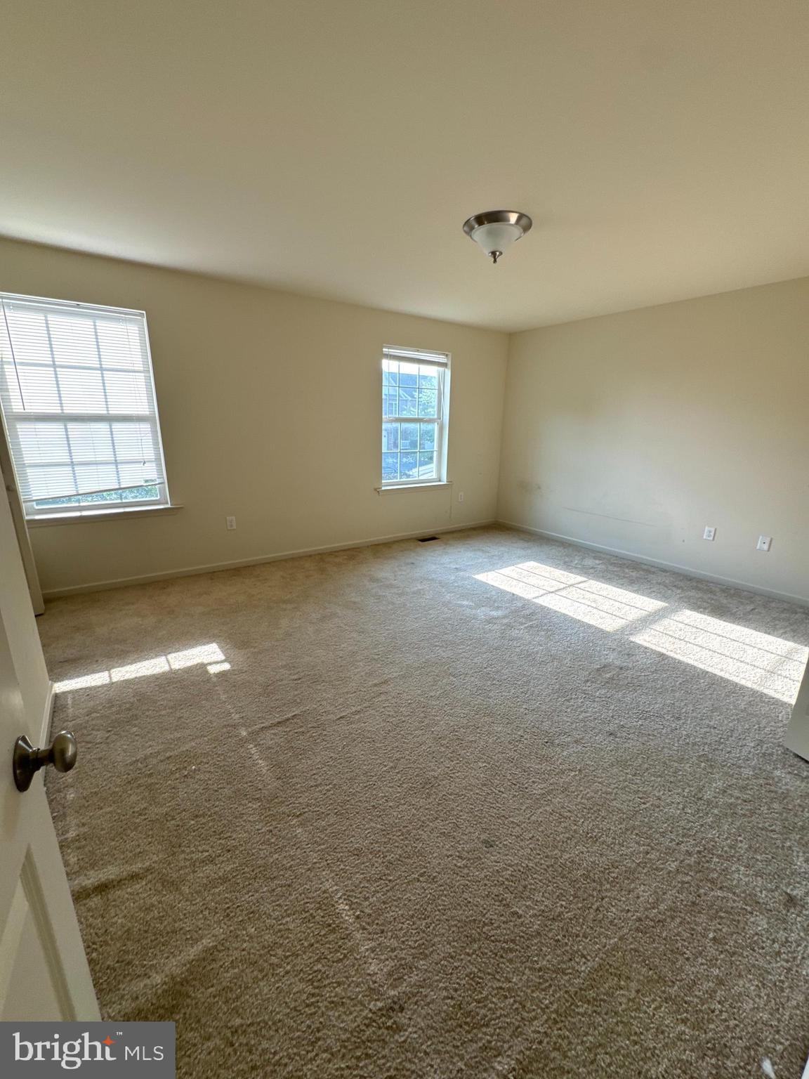100 Scully Place Lewisberry, PA 17339 - Photo 5 of 12 an empty room with a empty space and windows