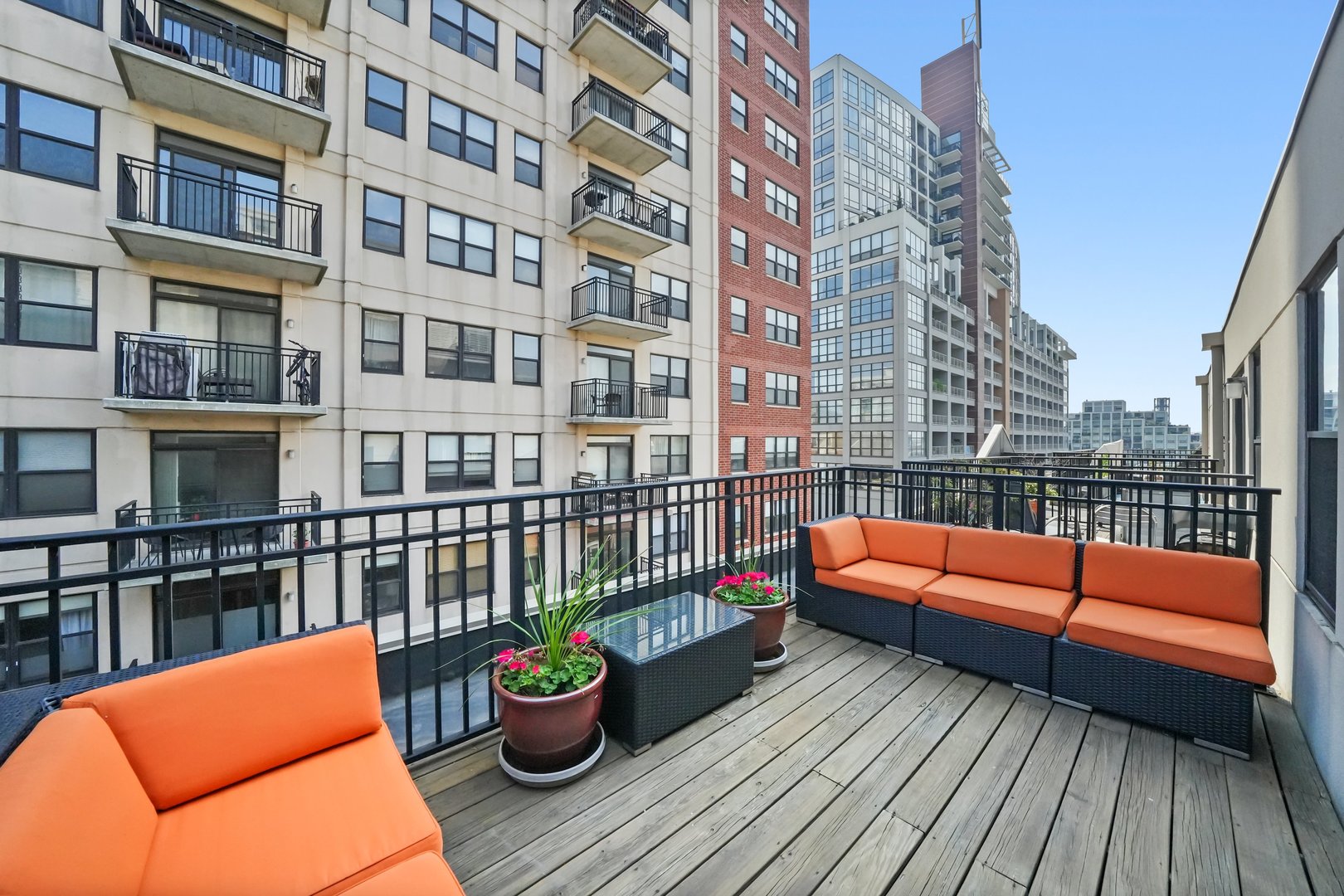 1529 South State Street, Unit 6 Chicago, IL 60605 - Photo 20 of 34 a balcony with city view and wooden floor