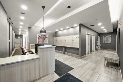 a room with gym equipment and large mirror