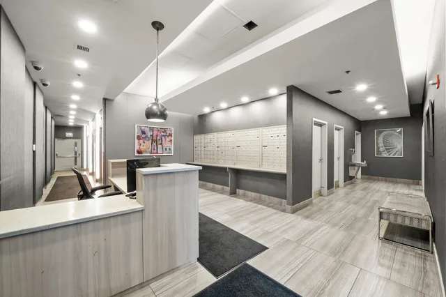 a room with gym equipment and large mirror