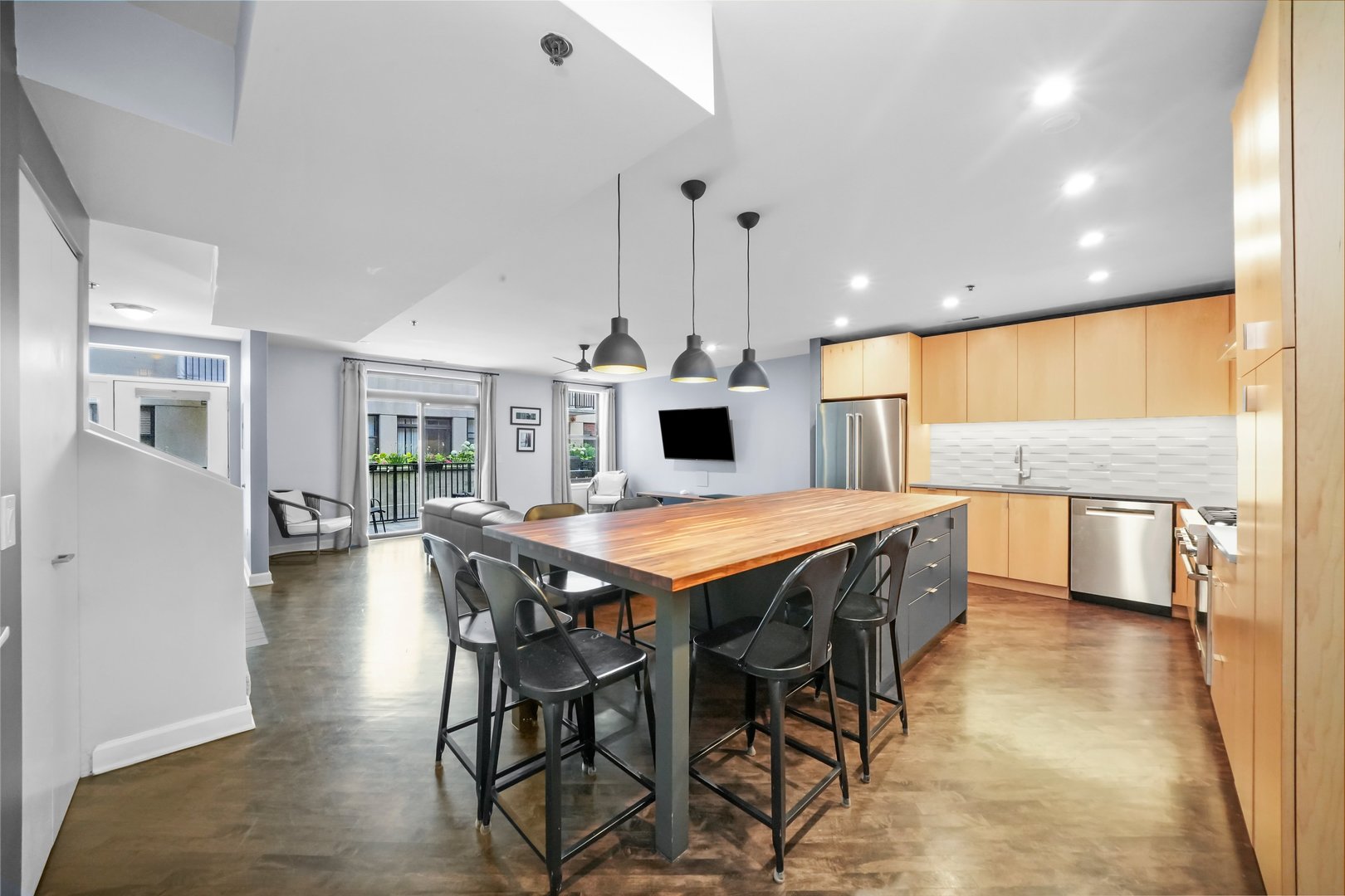 1529 South State Street, Unit 6 Chicago, IL 60605 - Photo 6 of 34 a dining hall with stainless steel appliances a dining table chairs and kitchen view