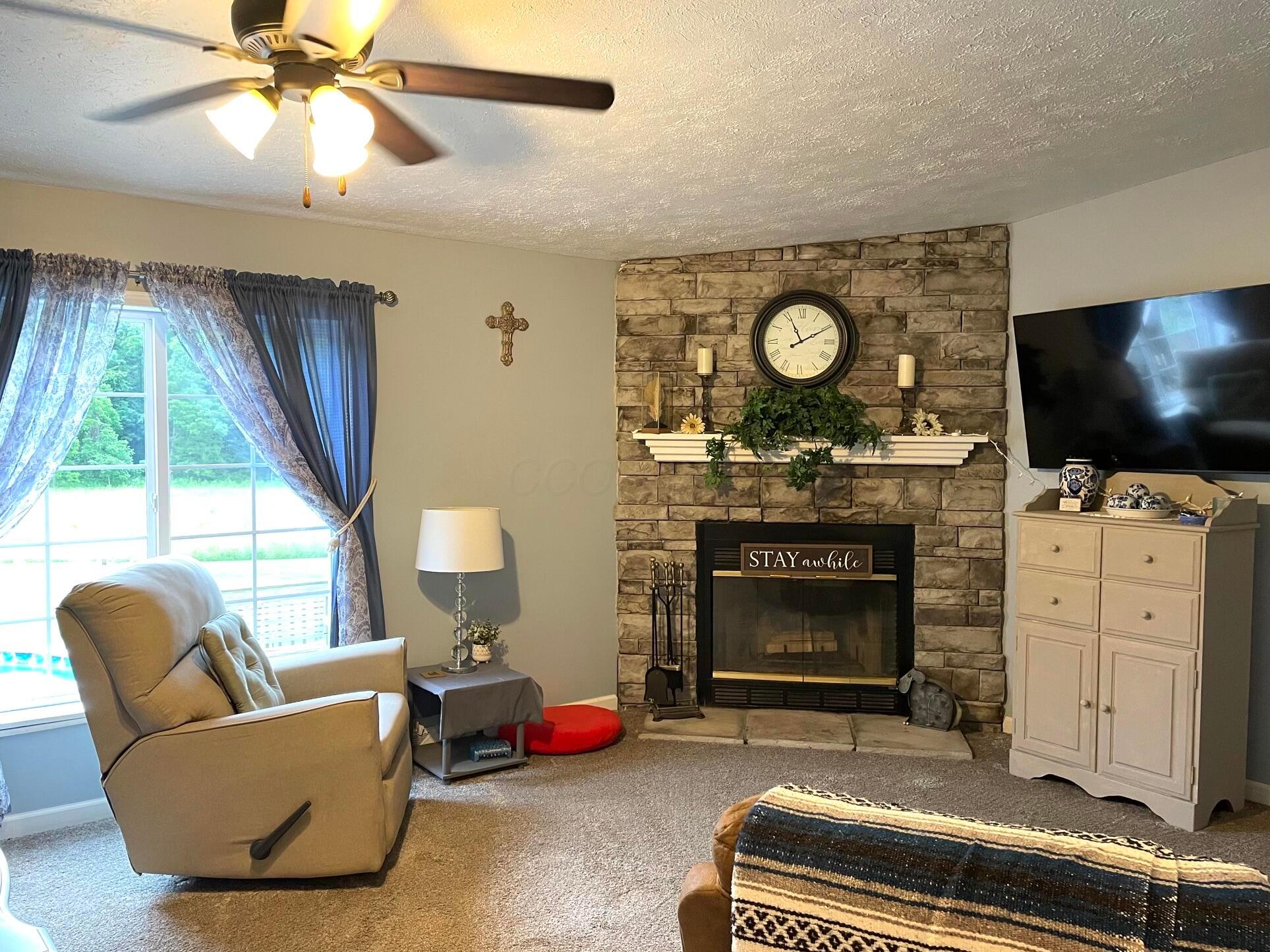 16282 Cox Road Logan, OH 43138 - Photo 18 of 40 Family room w/fireplace