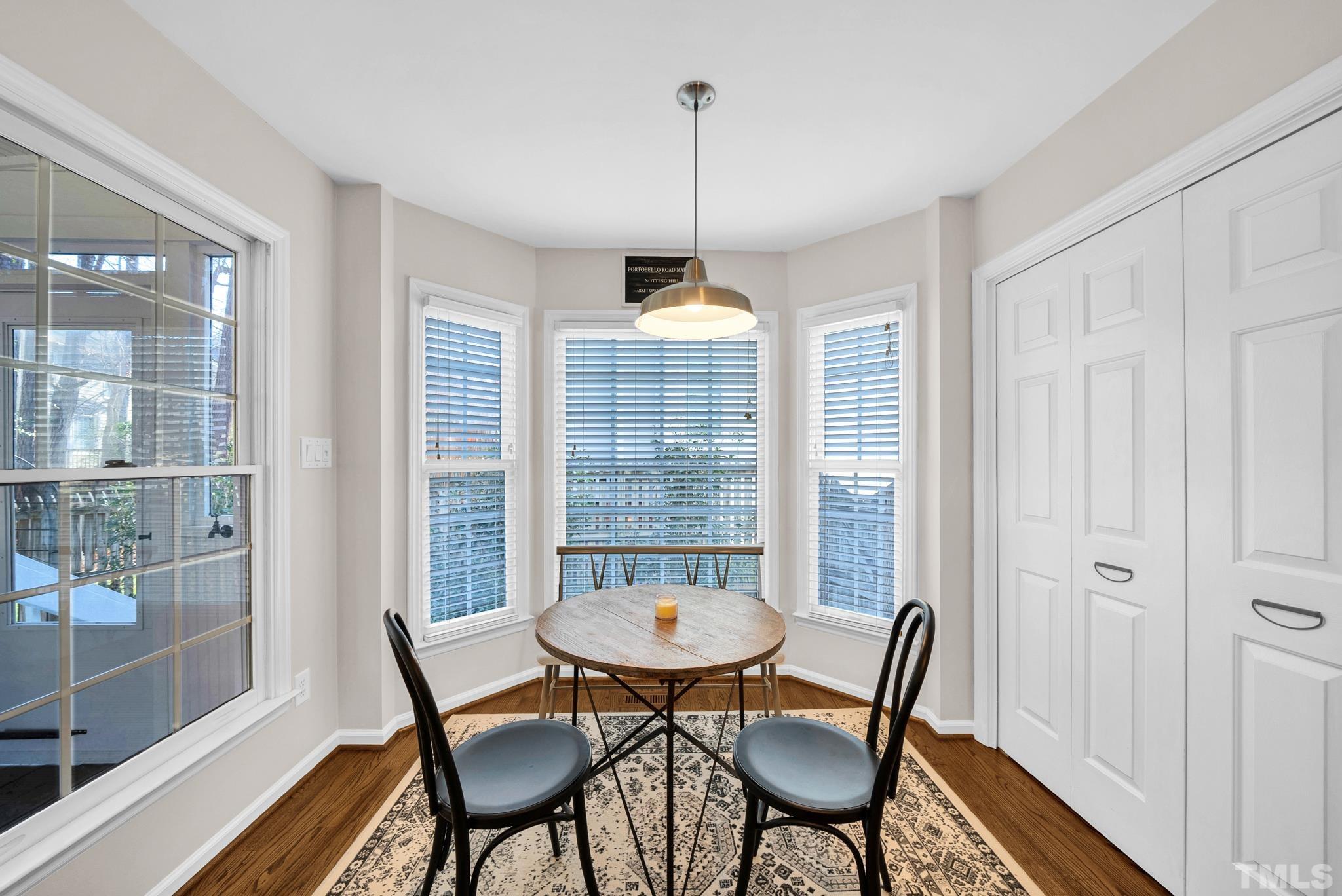 5308 Denmead Way Raleigh, NC 27613 - Photo 23 of 42 a view of a dining room with furniture window and wooden floor