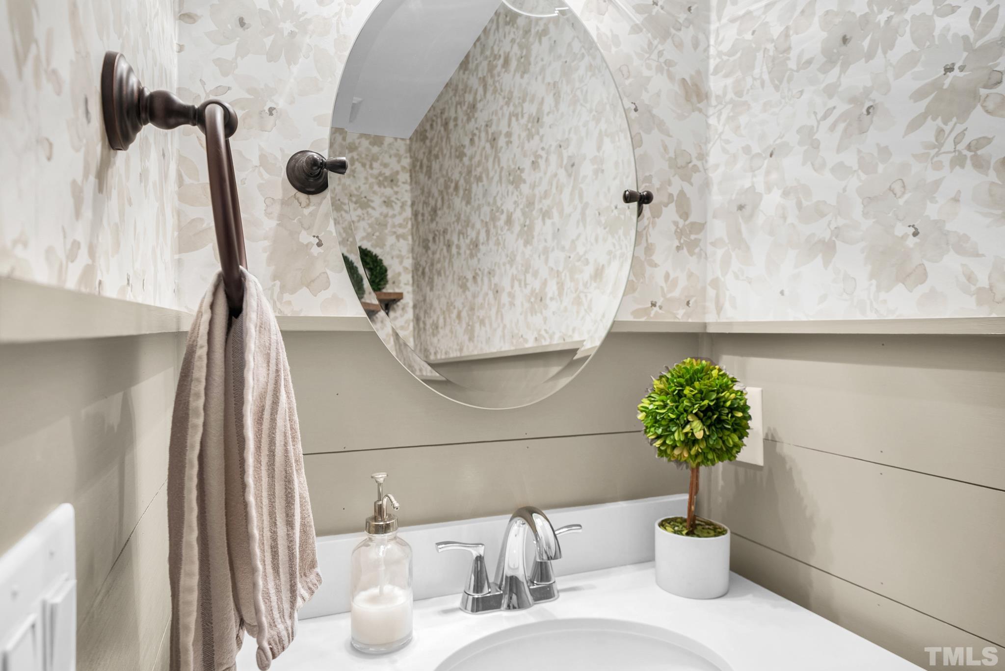 5308 Denmead Way Raleigh, NC 27613 - Photo 26 of 42 a bathroom with a sink and a mirror
