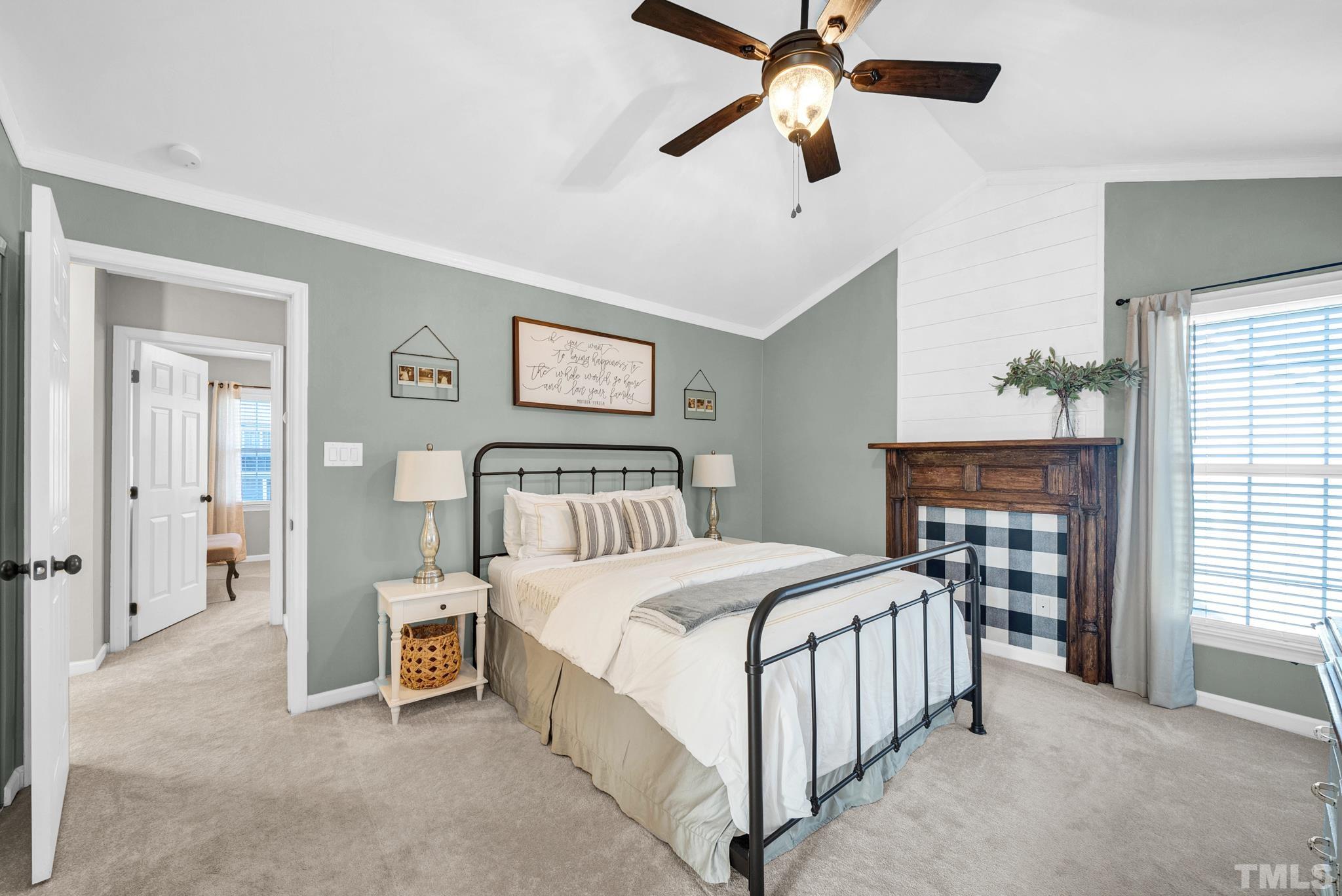 5308 Denmead Way Raleigh, NC 27613 - Photo 27 of 42 a bedroom with a bed chandelier and a window