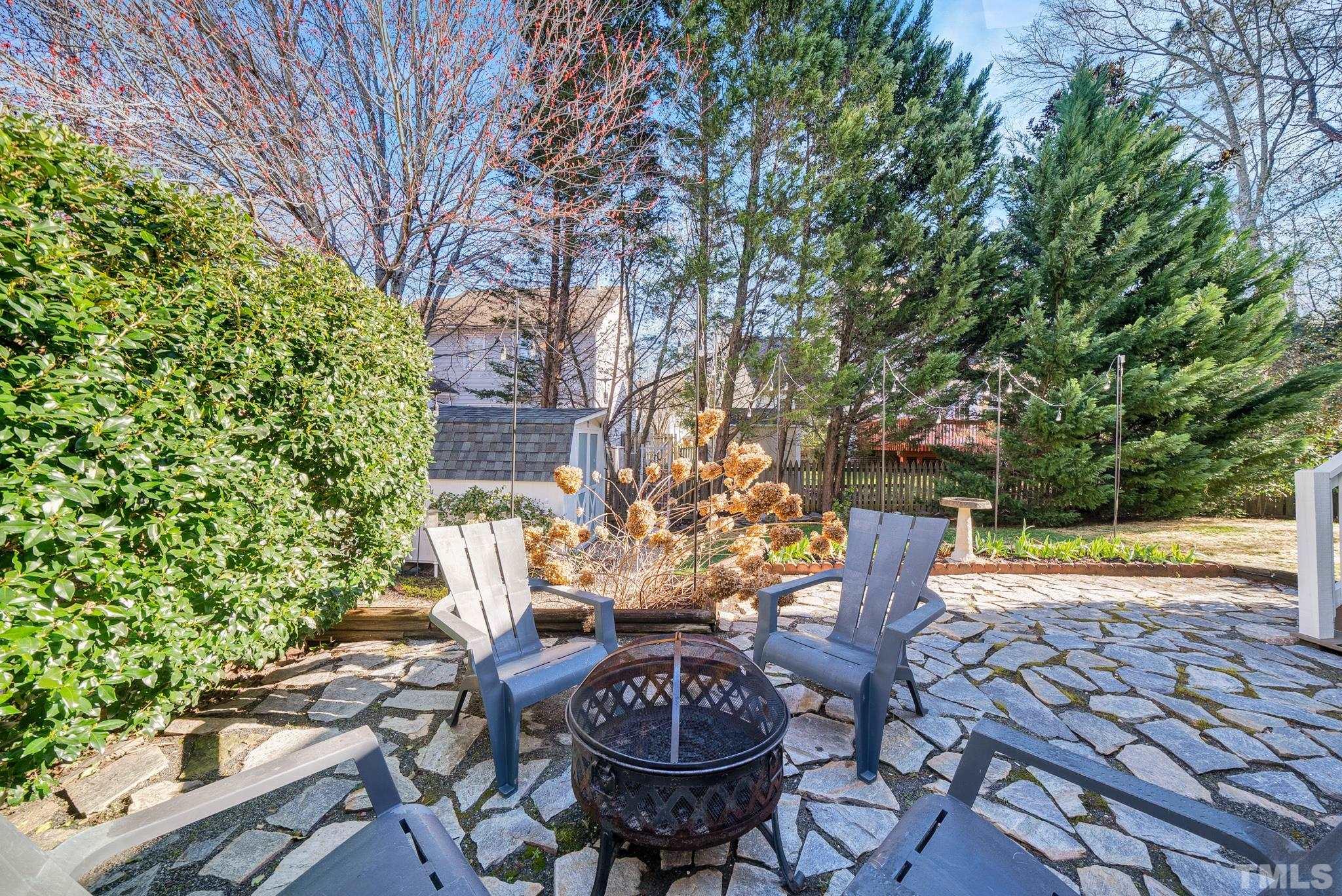 5308 Denmead Way Raleigh, NC 27613 - Photo 36 of 42 a view of a patio with table and chairs and potted plants